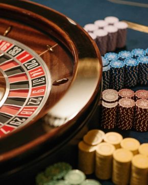 Close-up of a roulette table with colorful chips at a casino.